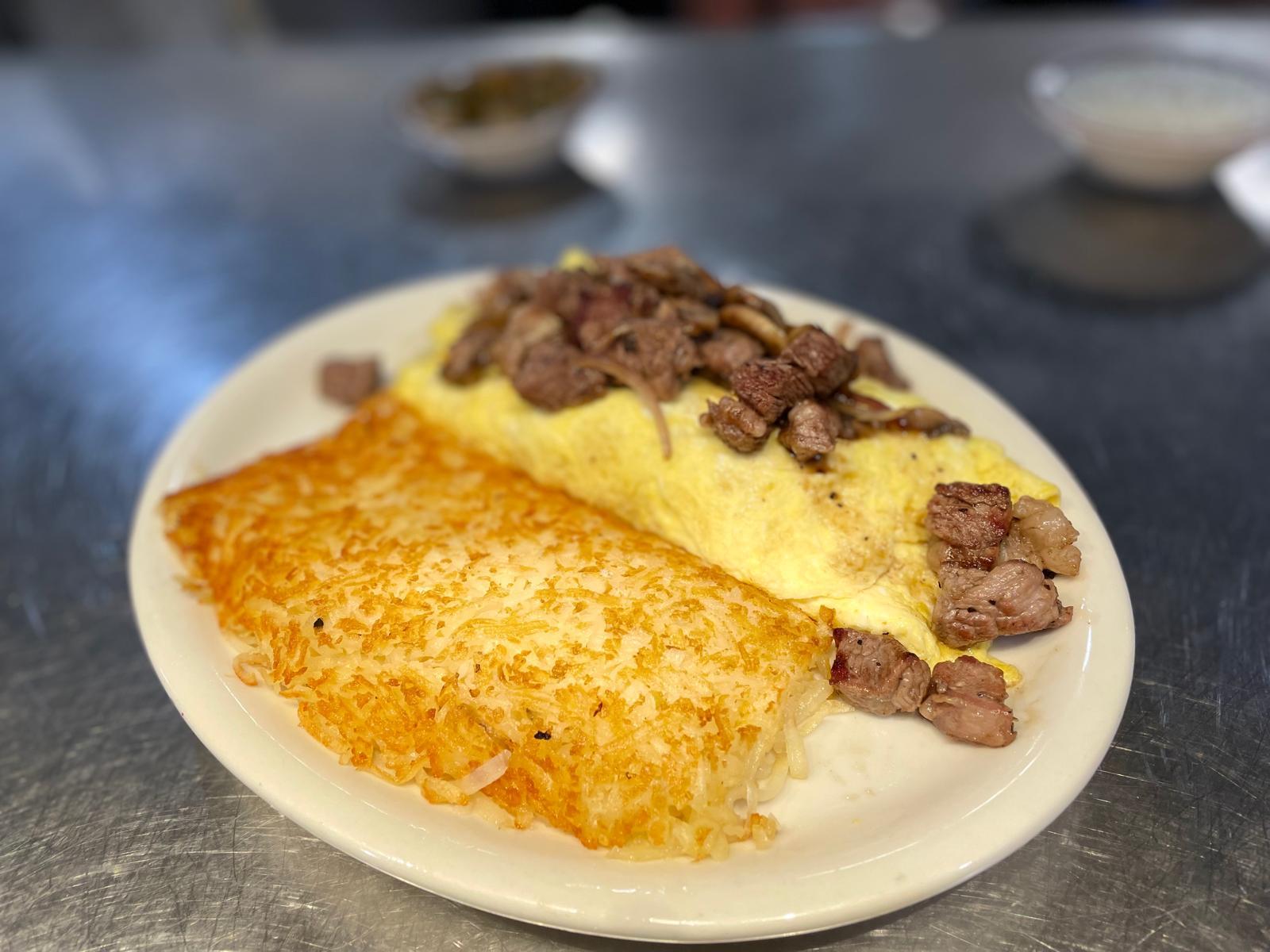 Ribeye omelet with fresh-cut ribeye, mushrooms and cheese at Ranch House Makarios in Vestavia Hills, AL