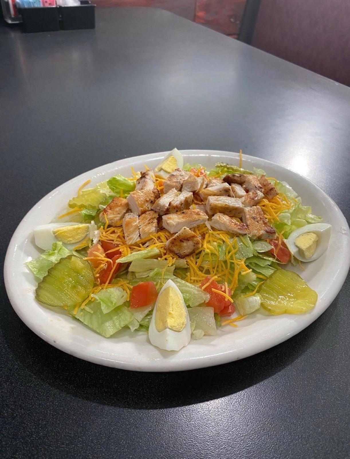 Chef salad with lettuce, tomatoes, cheddar, pickles and boiled egg at Ranch House Makarios in Vestavia Hills, AL