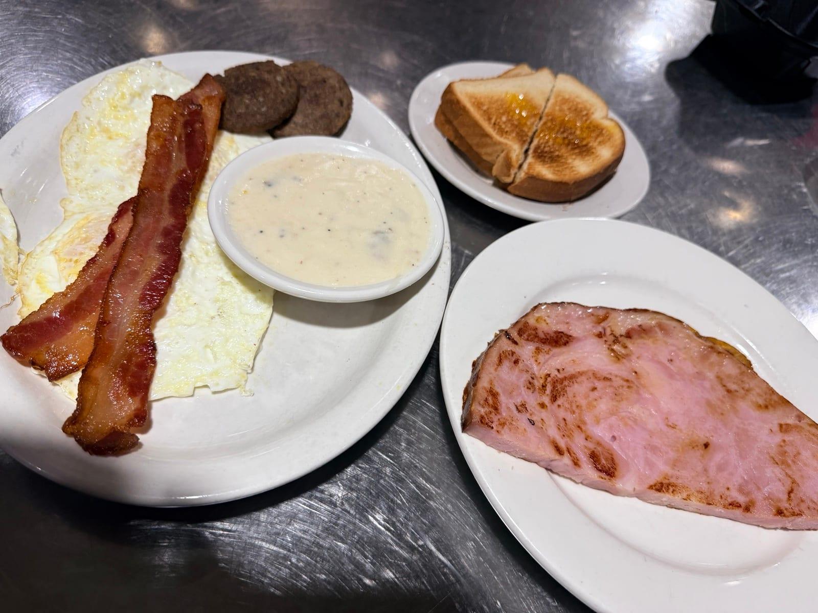 Meat lover's breakfast with eggs, bacon, sausage, ham, toast and gravy at Ranch House Makarios in Vestavia Hills, AL