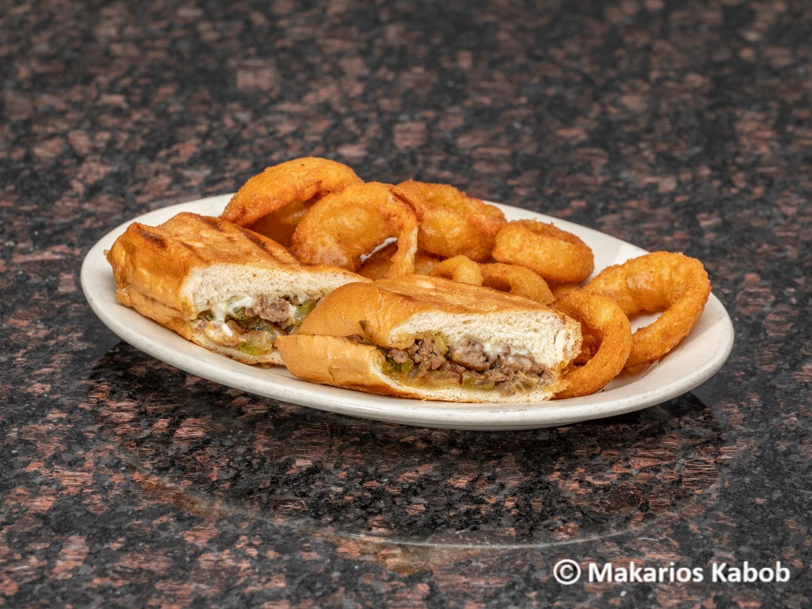 Philly steak sandwich with onion rings at Ranch House Makarios Family Restaurant in Vestavia Hills, AL