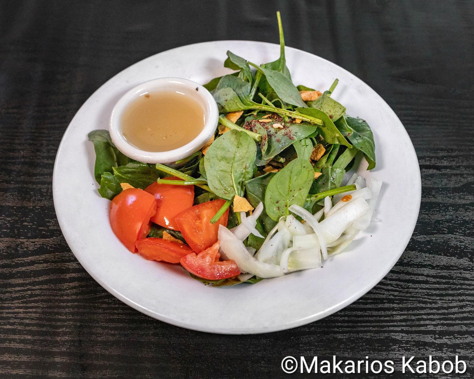 Spinach salad with tomato and Greek dressing at Ranch House Makarios Family Restaurant in Vestavia Hills, AL